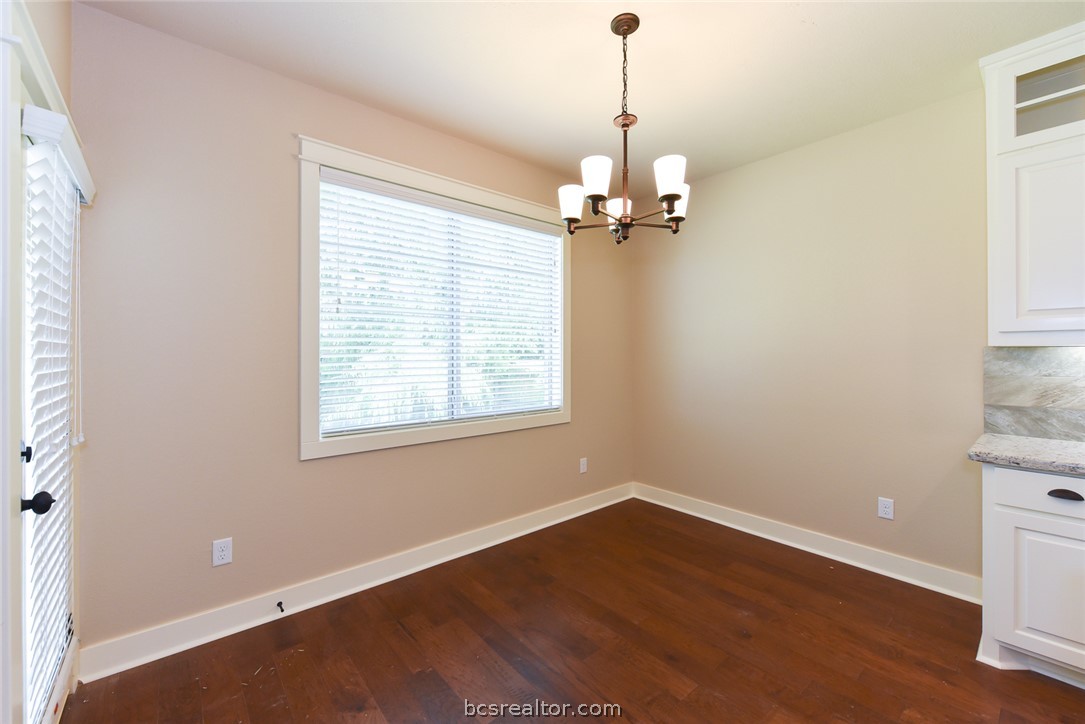 2136 Rockcliffe Loop College Station, TX 77845 - Photo 14 of 16 a view of empty room with wooden floor and window