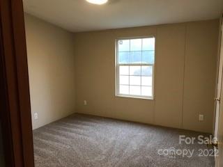 327 Rankin Hill Road Troutman, NC 28166 - Photo 2 of 9 an empty room with a window