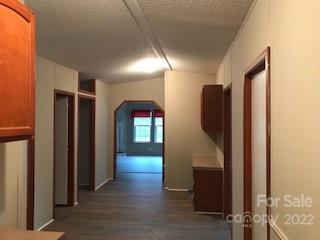 327 Rankin Hill Road Troutman, NC 28166 - Photo 5 of 9 a view of hallway with stairs and wooden floor