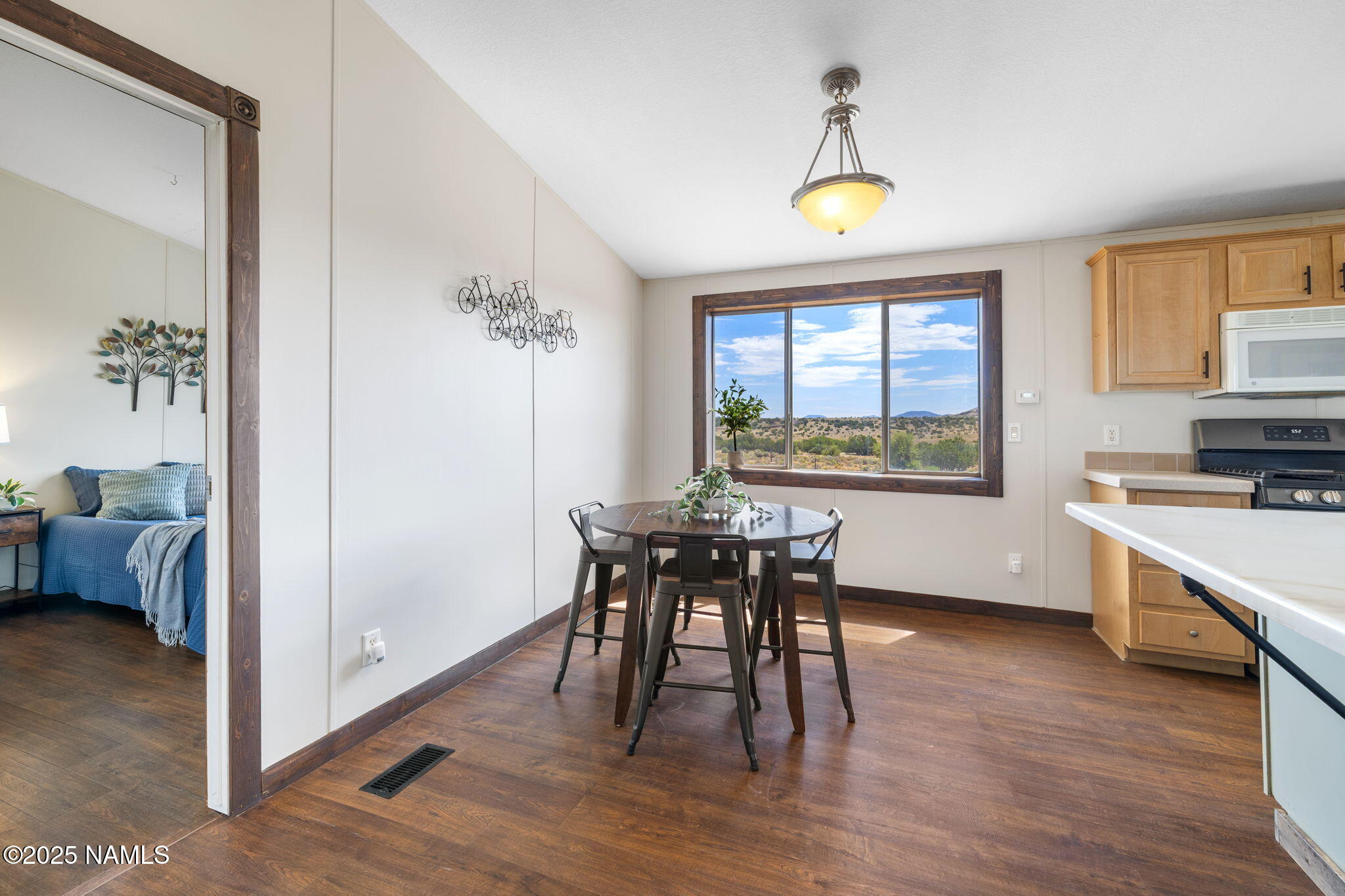 6792 South Quivero Road Williams, AZ 86046 - Photo 13 of 35 a view of a dining room with furniture window and wooden floor