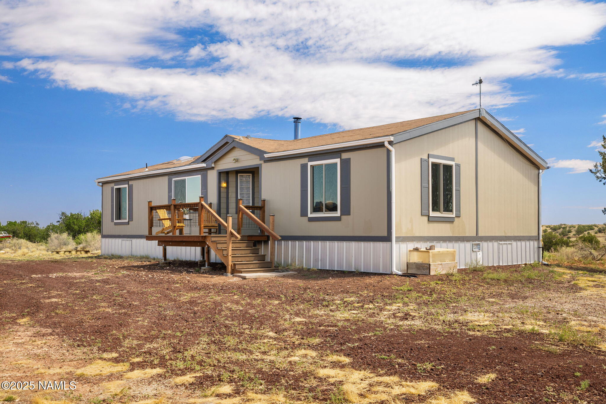6792 South Quivero Road Williams, AZ 86046 - Photo 2 of 35 a view of a house with backyard and porch