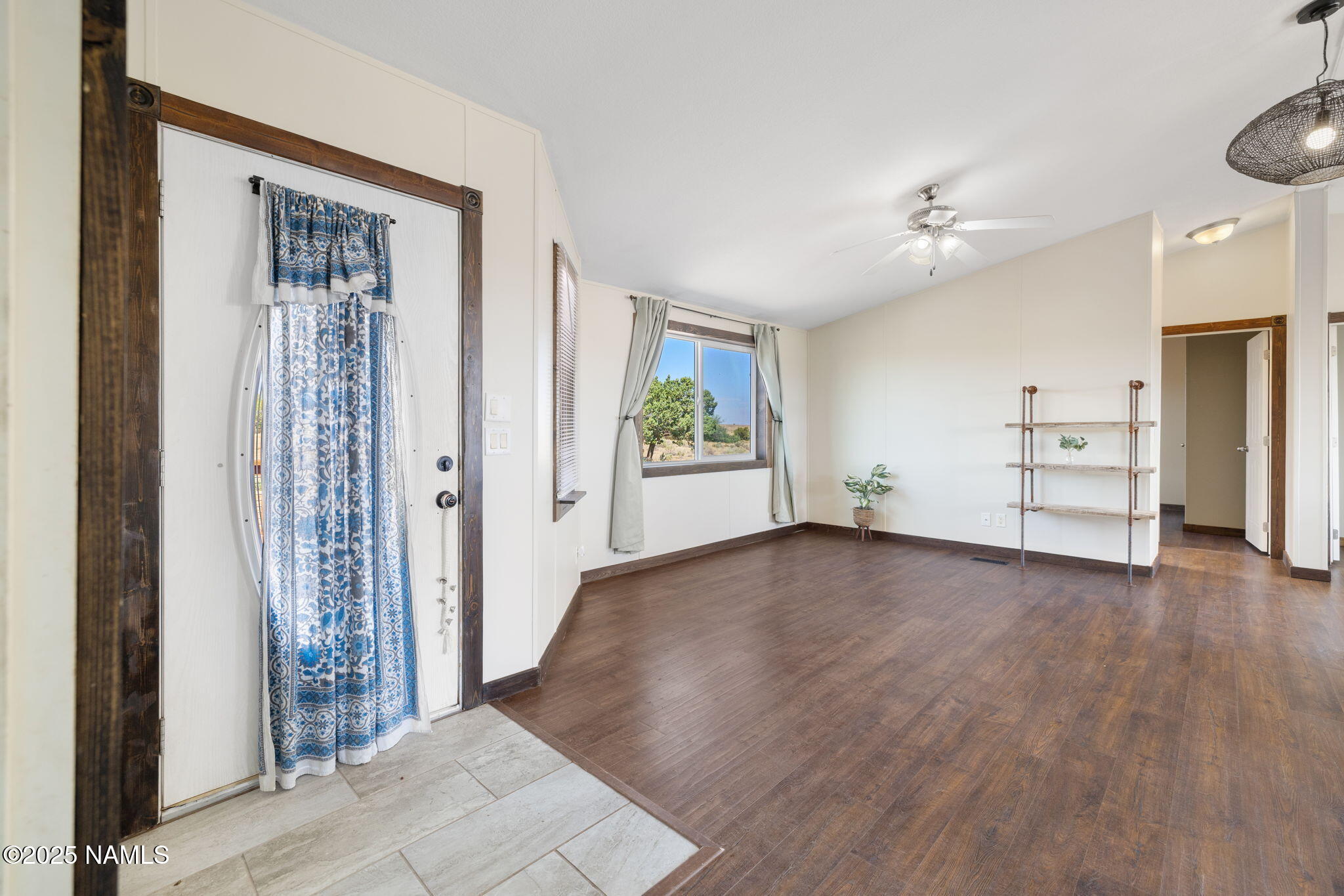 6792 South Quivero Road Williams, AZ 86046 - Photo 8 of 35 wooden floor in an empty room with a window