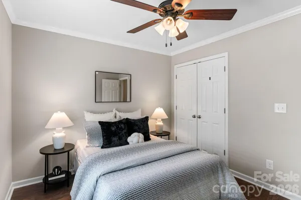 a bedroom with a bed and a lamp