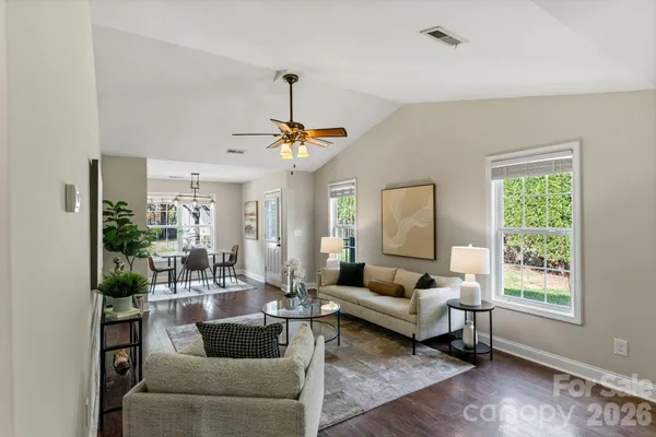 a living room with furniture and a window