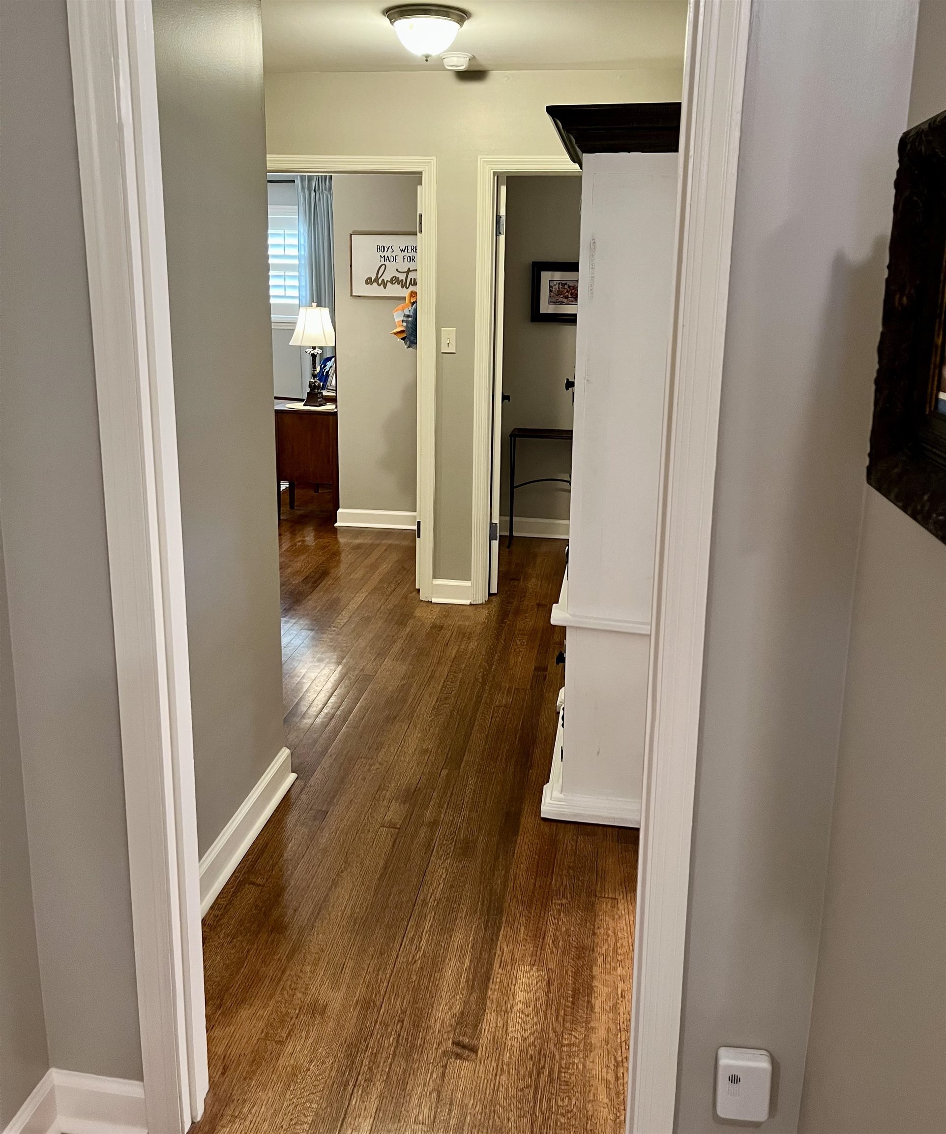 5572 Normandy Road Memphis, TN 38120 - Photo 11 of 25 a view of a hallway with wooden floor and closet