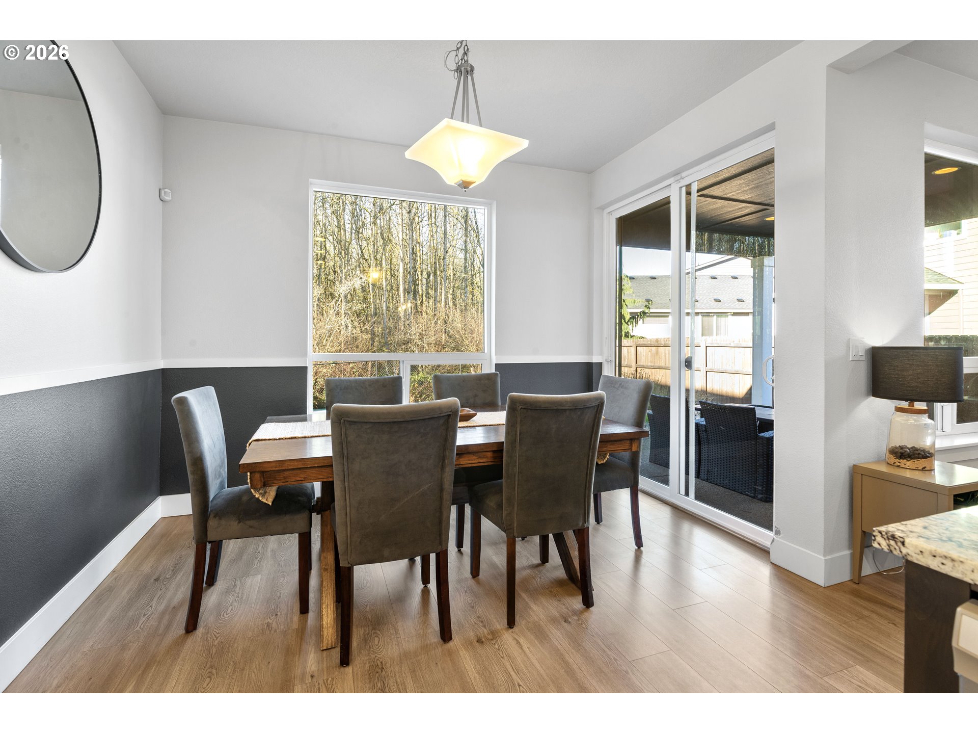 221 South 39th Drive Ridgefield, WA 98642 - Photo 15 of 35 a view of a dining room with furniture and wooden floor