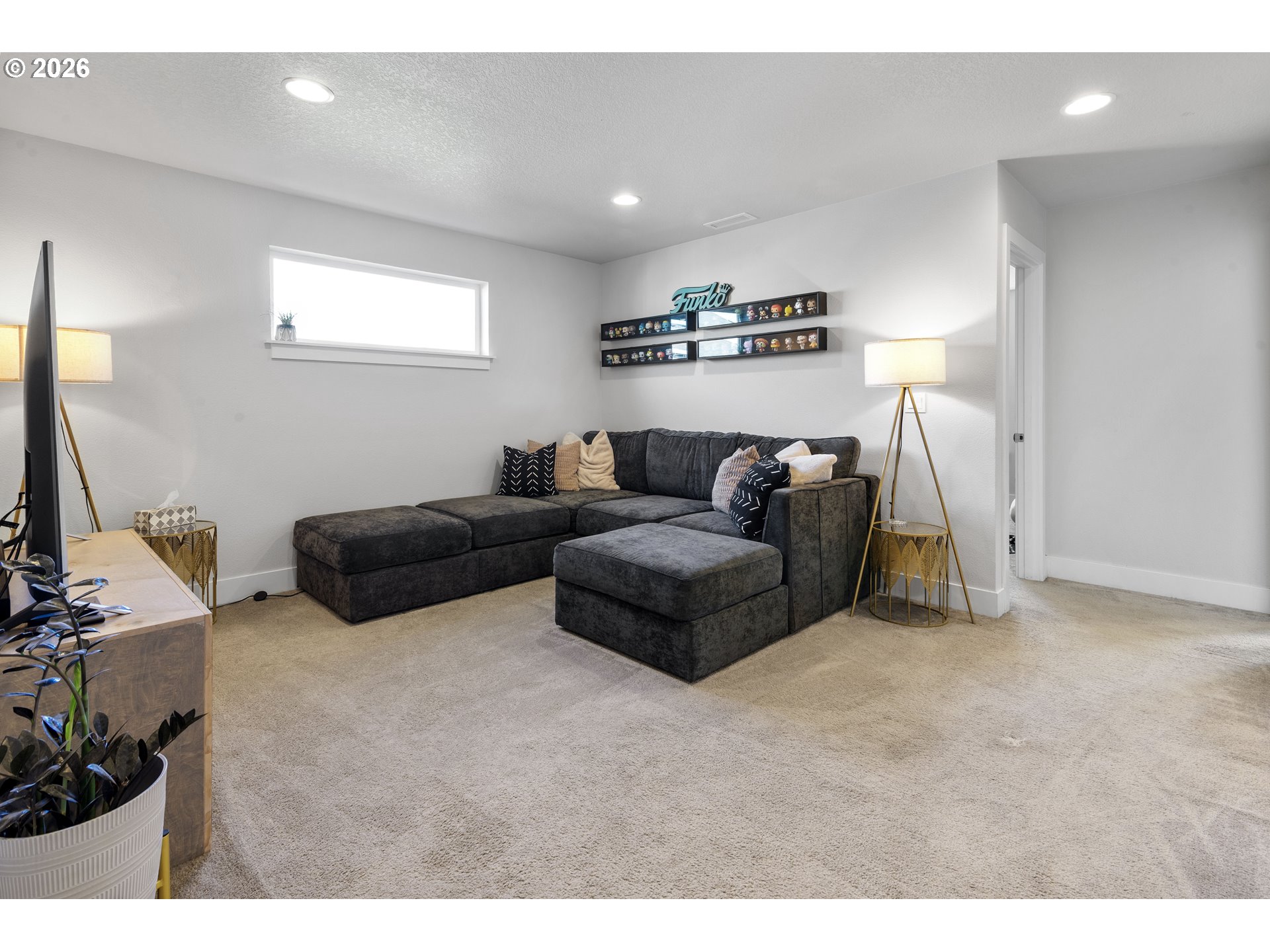 221 South 39th Drive Ridgefield, WA 98642 - Photo 20 of 35 a living room with furniture and a flat screen tv