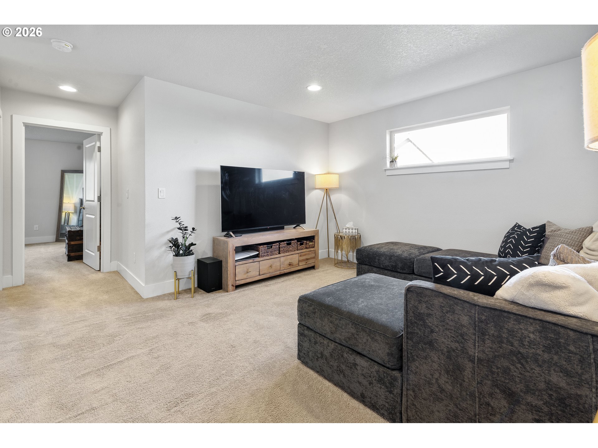 221 South 39th Drive Ridgefield, WA 98642 - Photo 22 of 35 a living room with furniture and a flat screen tv