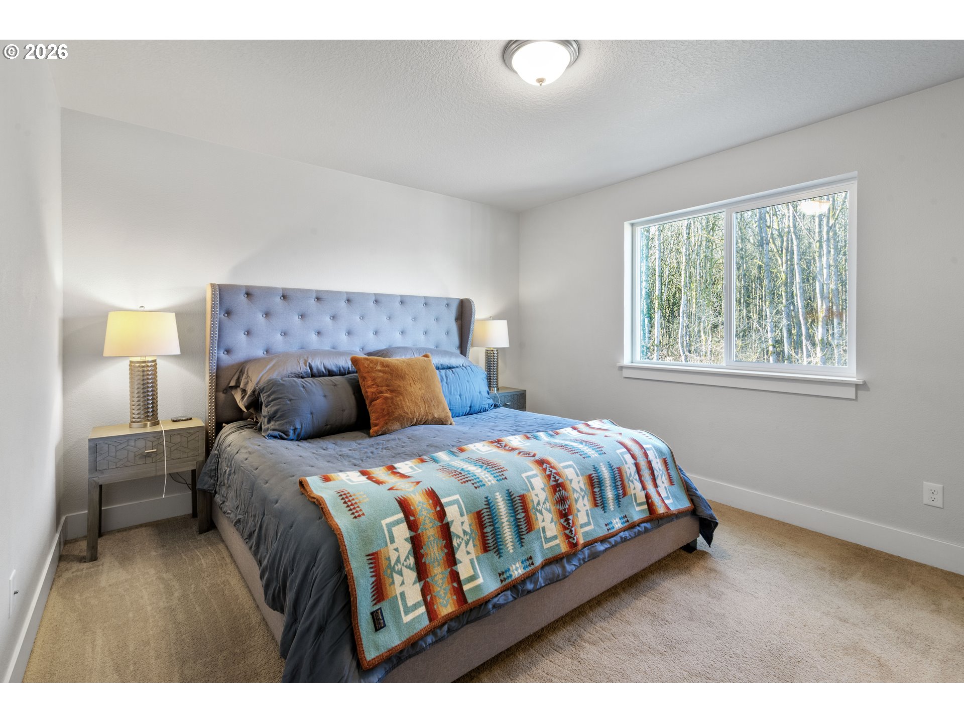 221 South 39th Drive Ridgefield, WA 98642 - Photo 24 of 35 a bedroom with a bed and window