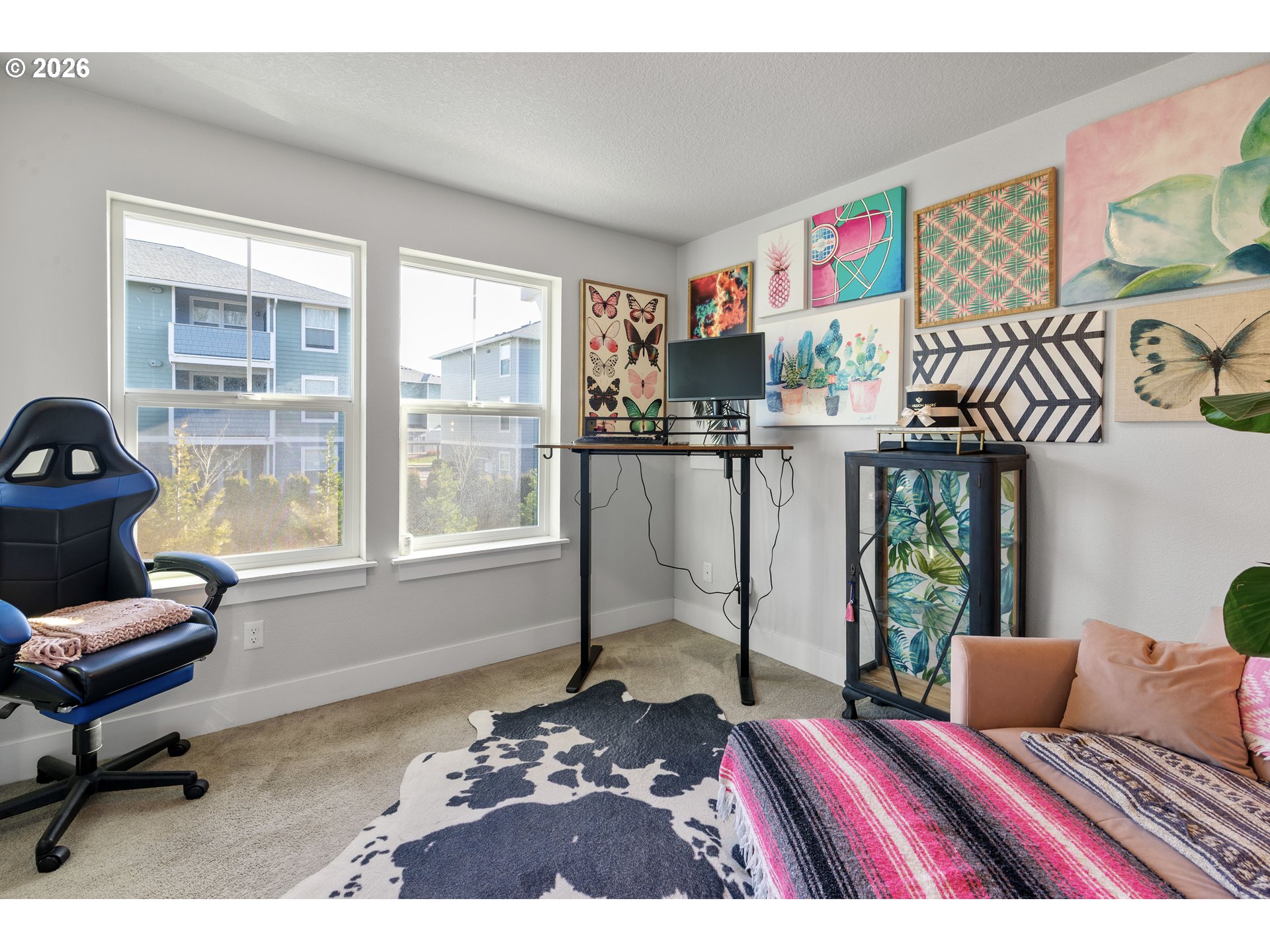 221 South 39th Drive Ridgefield, WA 98642 - Photo 29 of 35 a living room with furniture and a floor to ceiling window