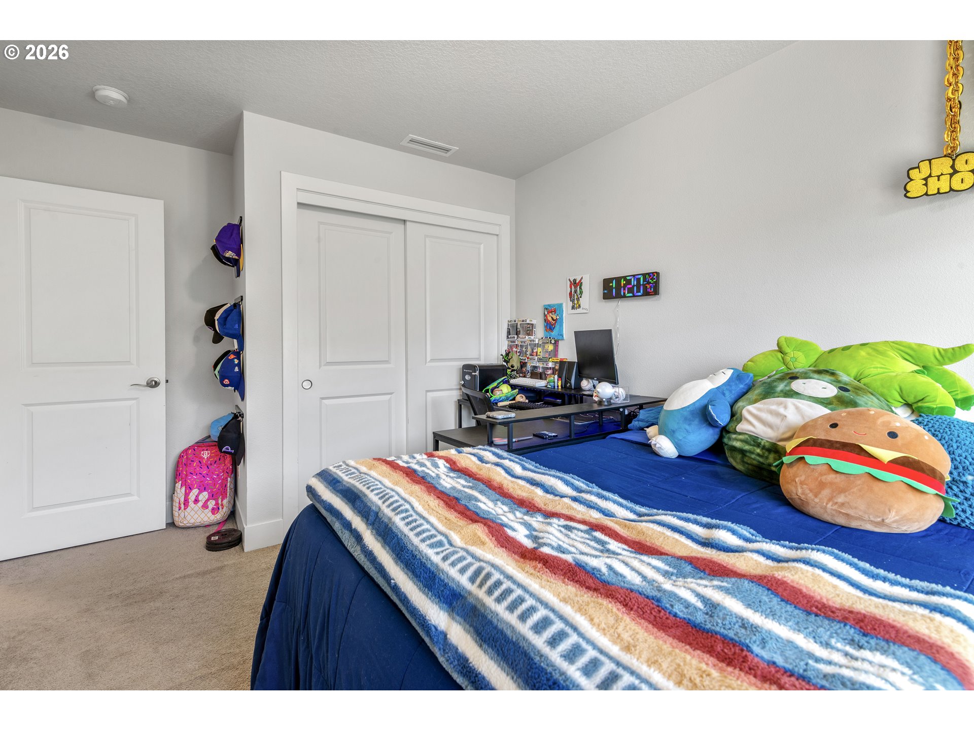 221 South 39th Drive Ridgefield, WA 98642 - Photo 31 of 35 a bedroom with a bed and toys