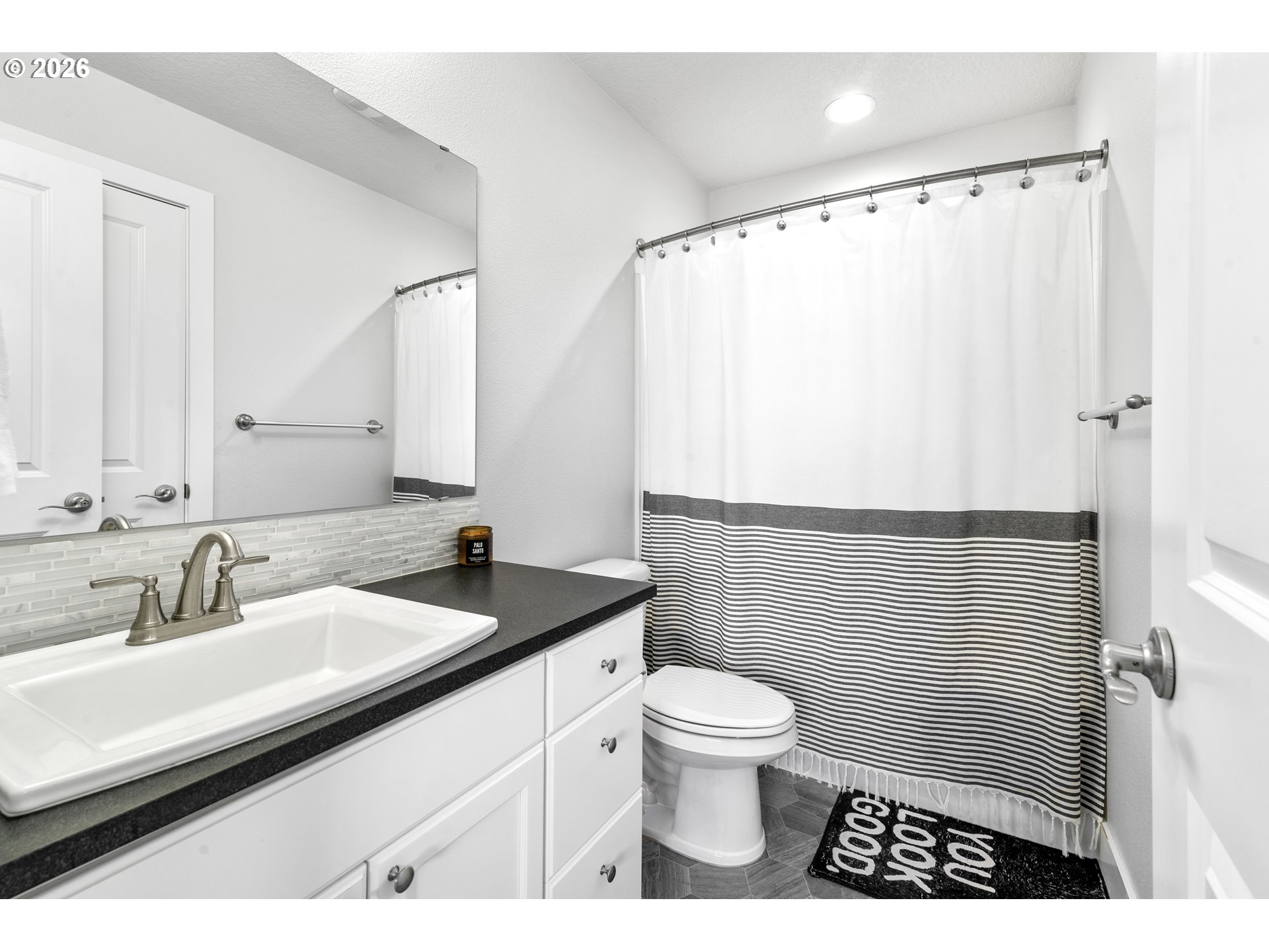 221 South 39th Drive Ridgefield, WA 98642 - Photo 32 of 35 a bathroom with a sink toilet and shower