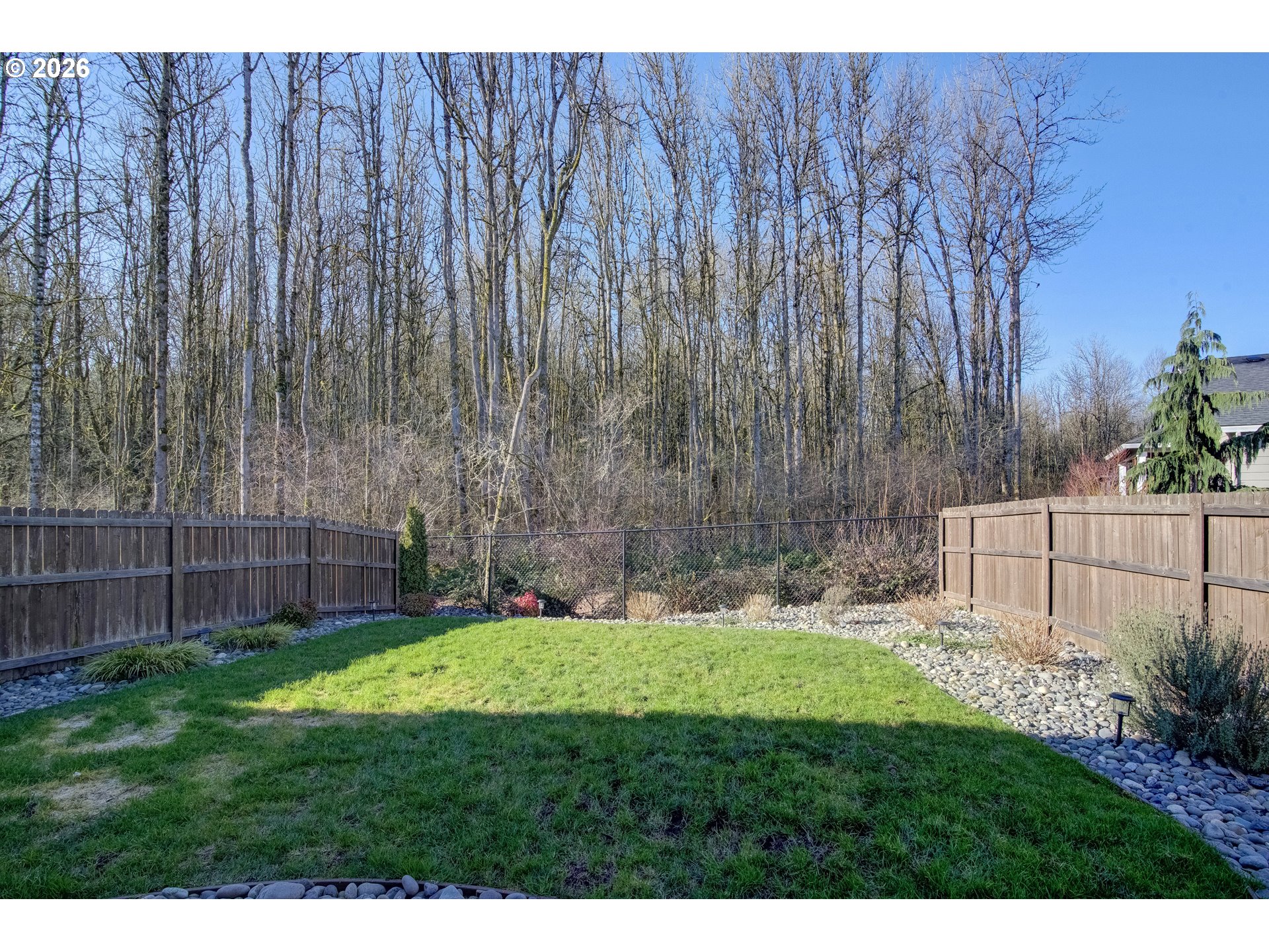 221 South 39th Drive Ridgefield, WA 98642 - Photo 33 of 35 a garden with trees in front of it
