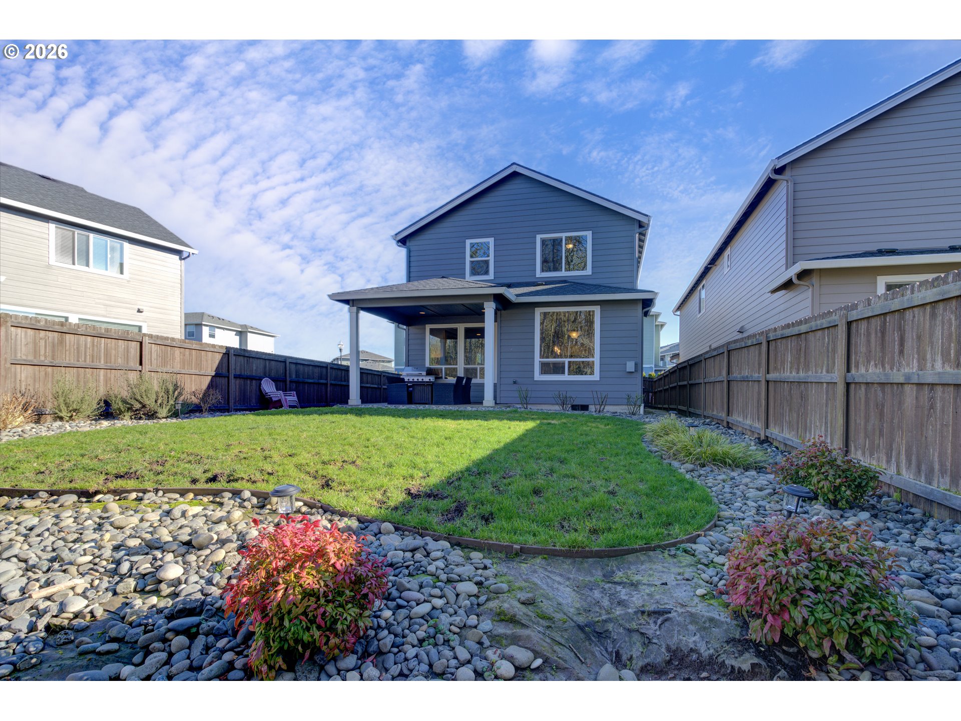 221 South 39th Drive Ridgefield, WA 98642 - Photo 35 of 35 a view of a brick house with a big yard plants and large trees