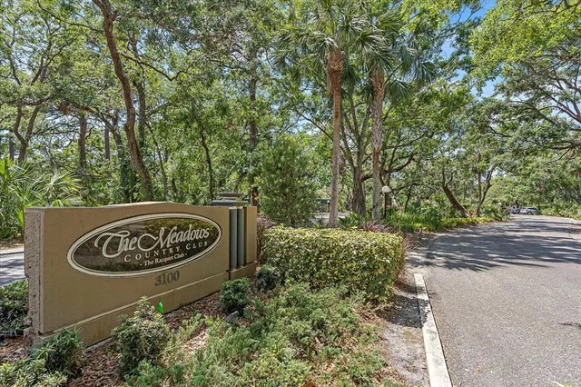 a sign that is on a brick wall