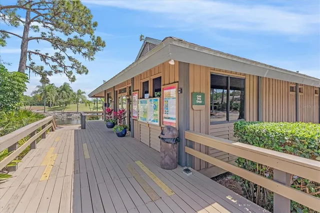 a view of a house with wooden deck
