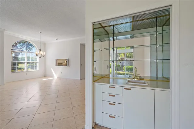 a kitchen with a cabinets and window