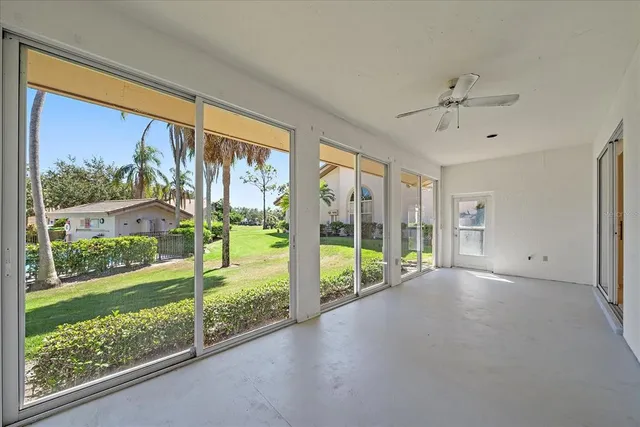 a view of empty room with floor to ceiling window