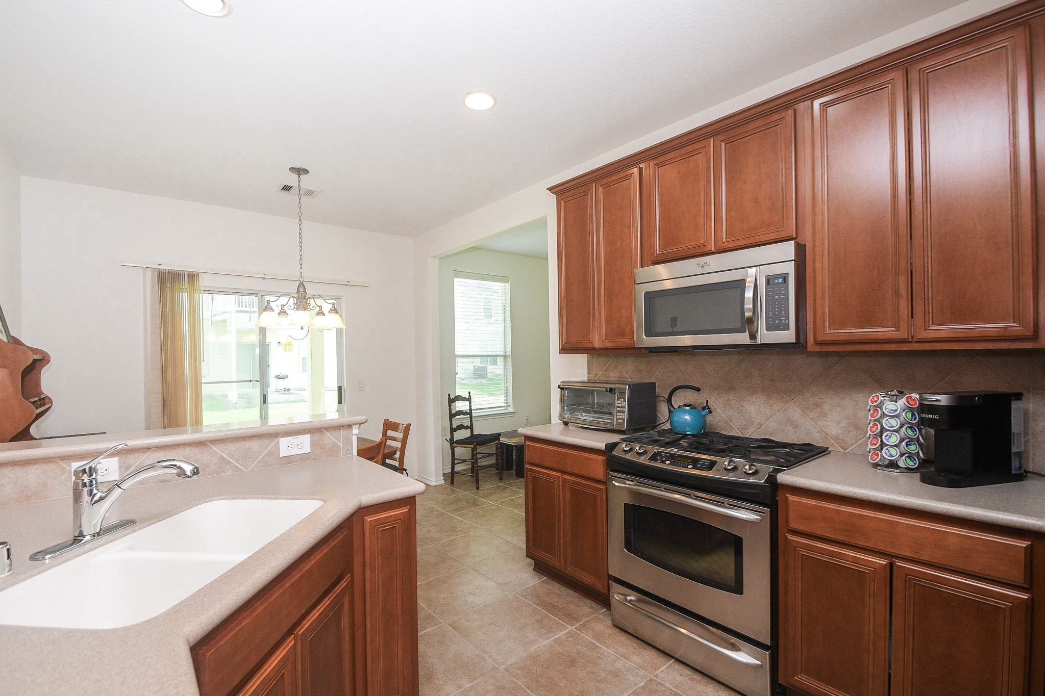 13600 Breton Ridge Street, Unit 36F Houston, TX 77070 - Photo 17 of 38 Functional kitchen layout designed for everyday convenience.