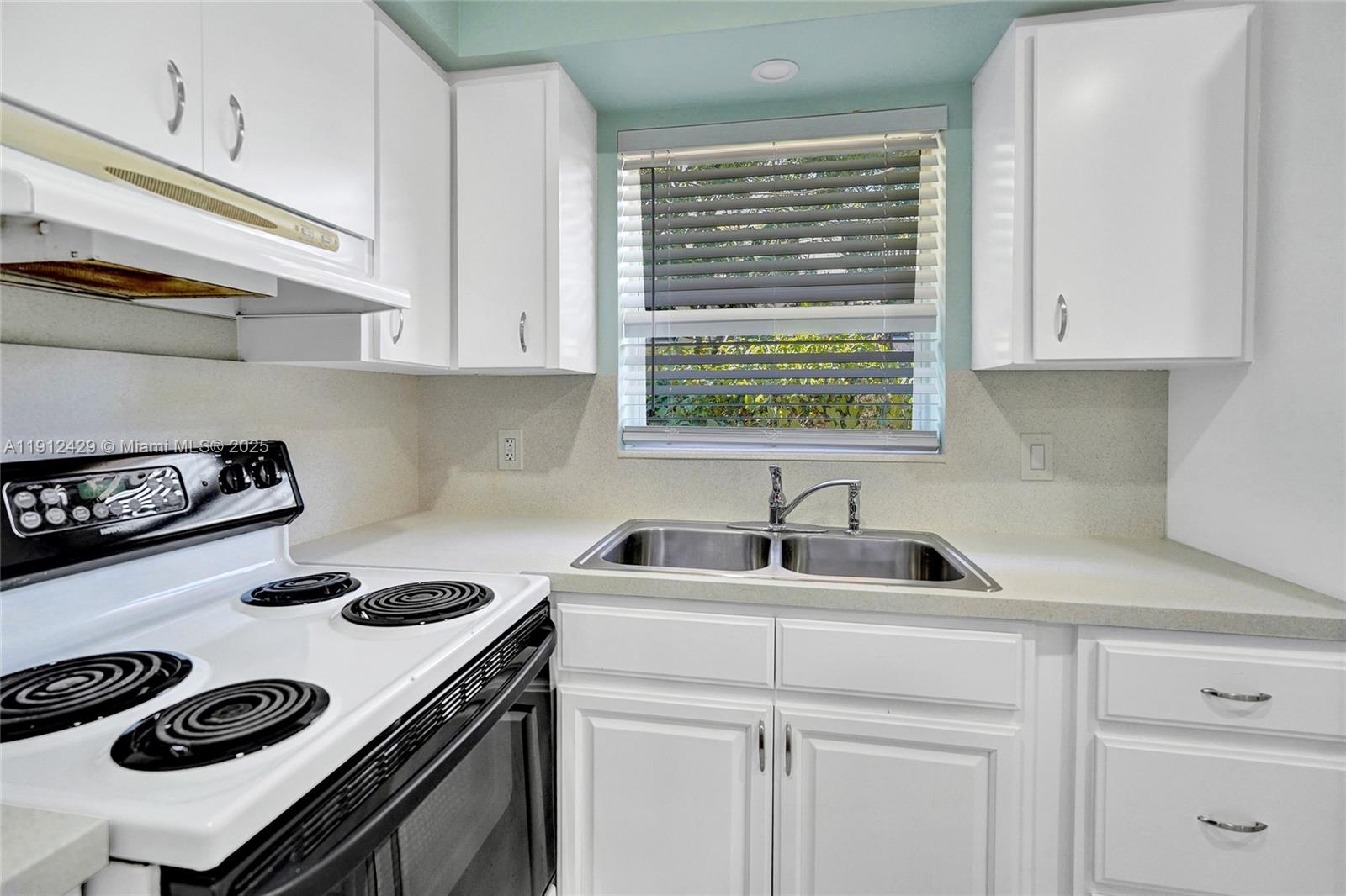 720 Southeast 15th Street, Unit 2R Fort Lauderdale, FL 33316 - Photo 16 of 33 a kitchen with sink and cabinets
