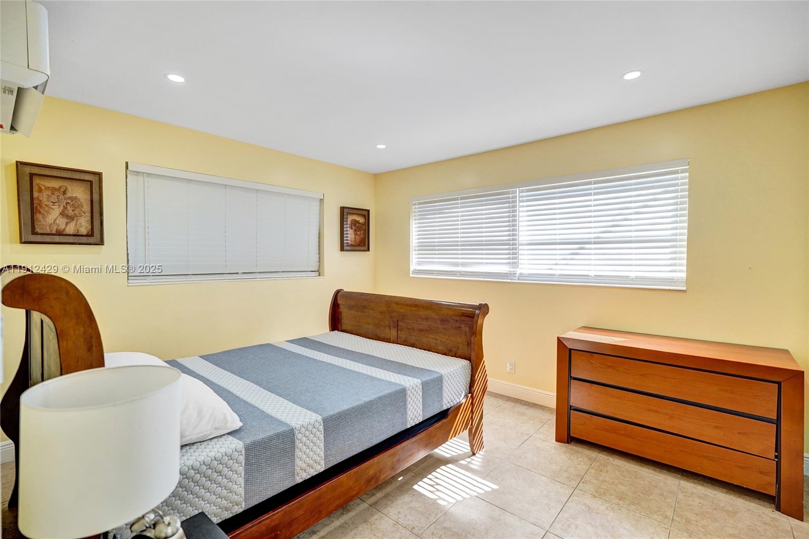 720 Southeast 15th Street, Unit 2R Fort Lauderdale, FL 33316 - Photo 17 of 33 a bedroom with a bed and a dresser