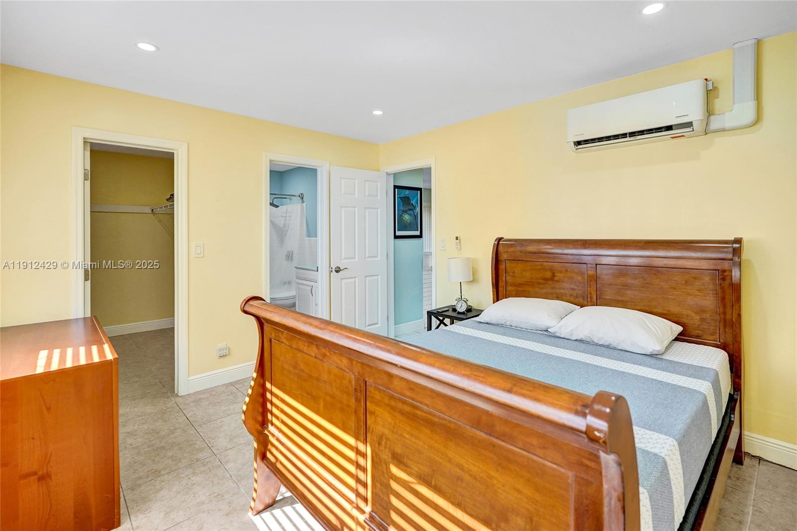 720 Southeast 15th Street, Unit 2R Fort Lauderdale, FL 33316 - Photo 20 of 33 a bedroom with a bed and a dresser in it