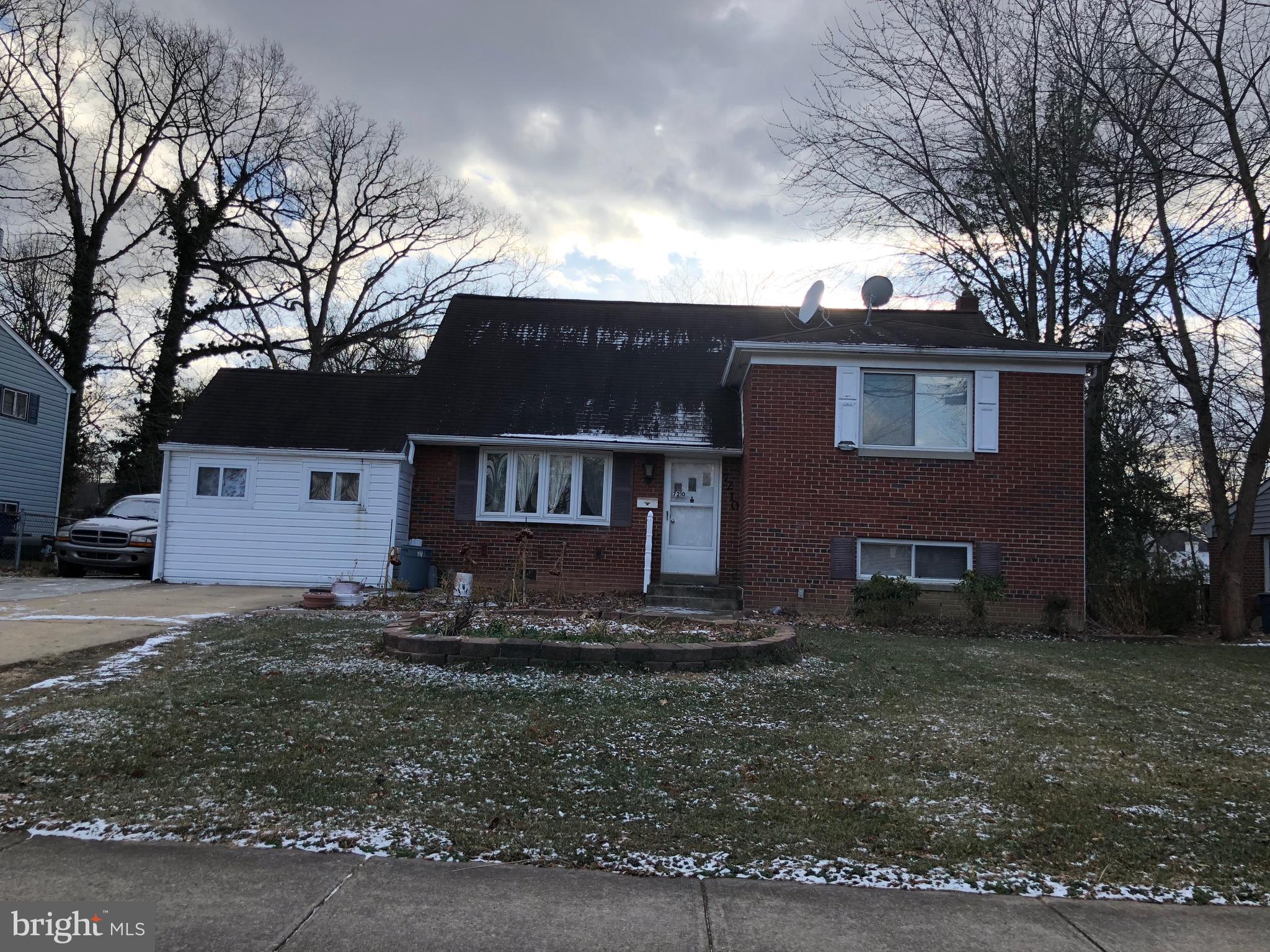 7210 Reservoir Road Springfield, VA 22150 - Photo 1 of 1 a front view of a house with trees