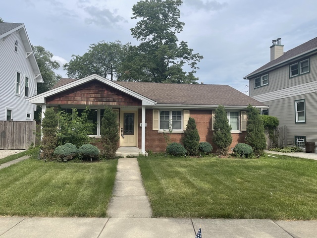 3845 McCormick Avenue Brookfield, IL 60513 - Photo 1 of 6 a front view of a house with a yard