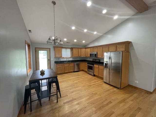 3845 McCormick Avenue Brookfield, IL 60513 - Photo 5 of 6 a view of kitchen with furniture and wooden floor