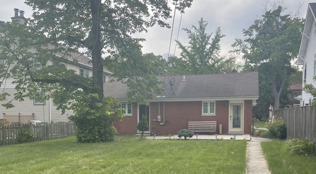 3845 McCormick Avenue Brookfield, IL 60513 - Photo 6 of 6 front view of a house with a yard