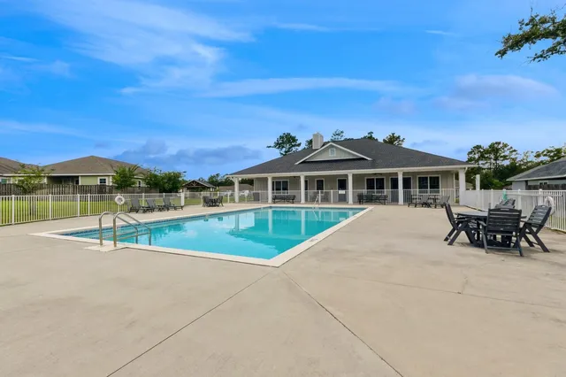 a view of house with a swimming pool