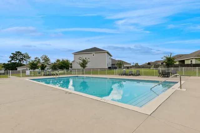 a view of a swimming pool with an ocean view