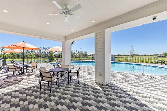 a outdoor space with chairs a table and chairs