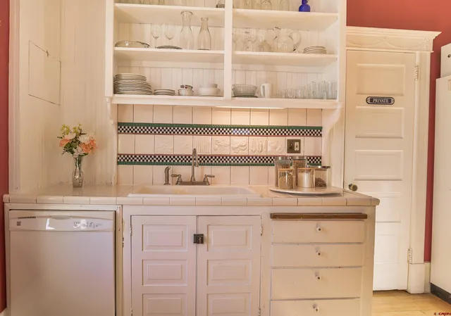 a kitchen with stainless steel appliances cabinets and a counter top space