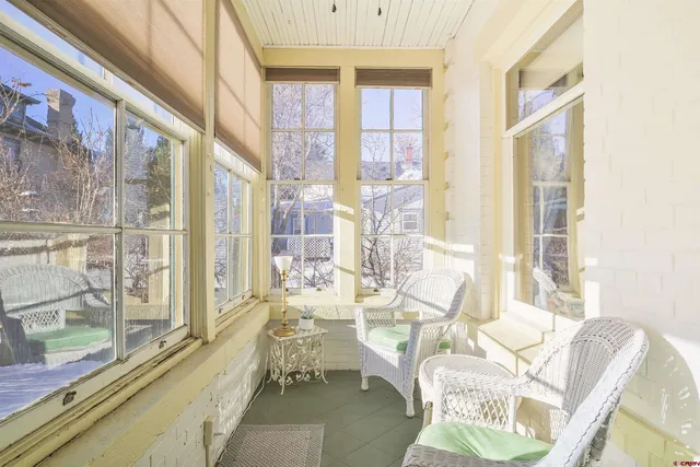 a view of a room with furniture window and wooden floor