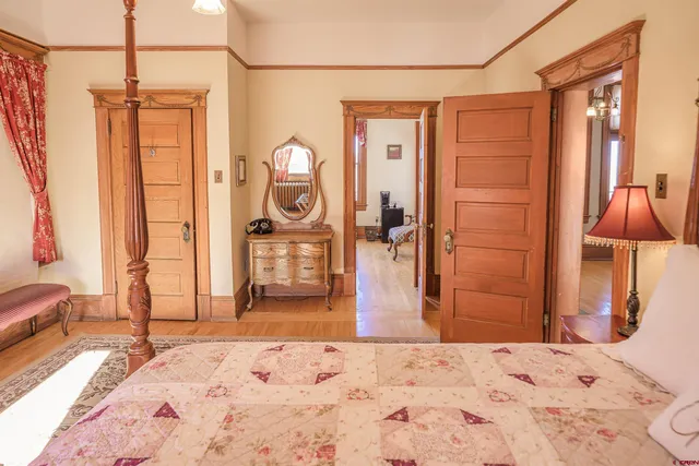 a bedroom with furniture and a window