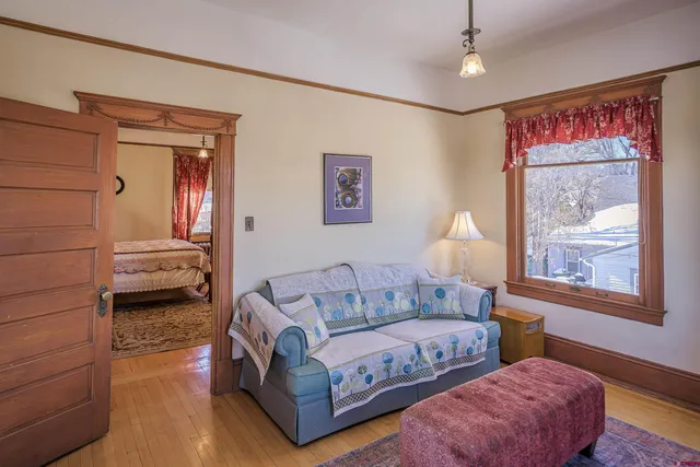 a bathroom with a sink mirror and toilet