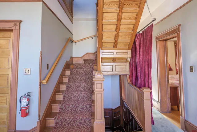 a bathroom with a toilet sink a mirror and a shower