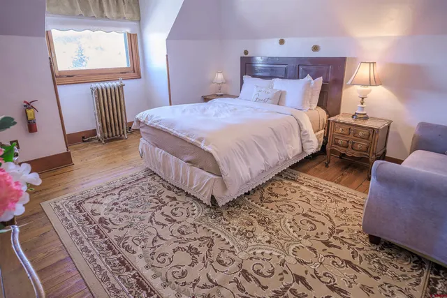 a bathroom with a sink mirror vanity and toilet
