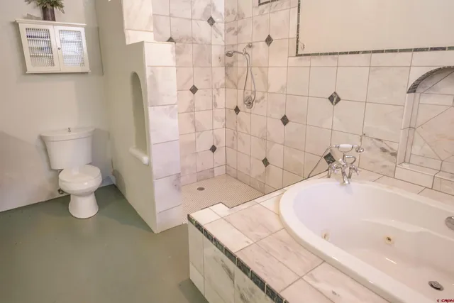 a bathroom with a sink a mirror and a window