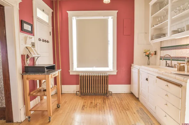 a kitchen with cabinets and a window