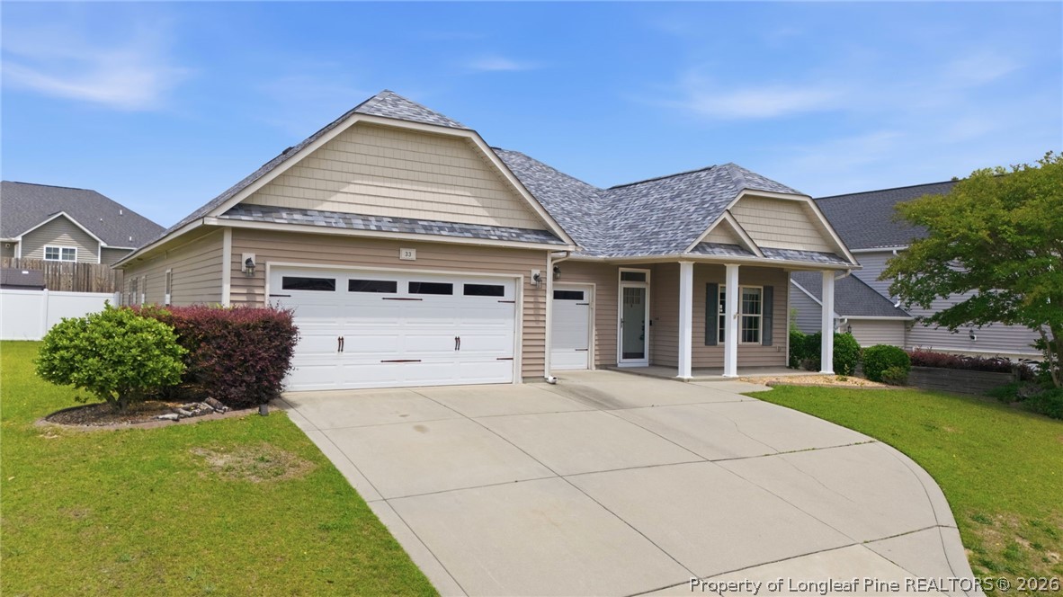 33 Colonist Place Cameron, NC 28326 - Photo 2 of 47 a front view of a house with a yard