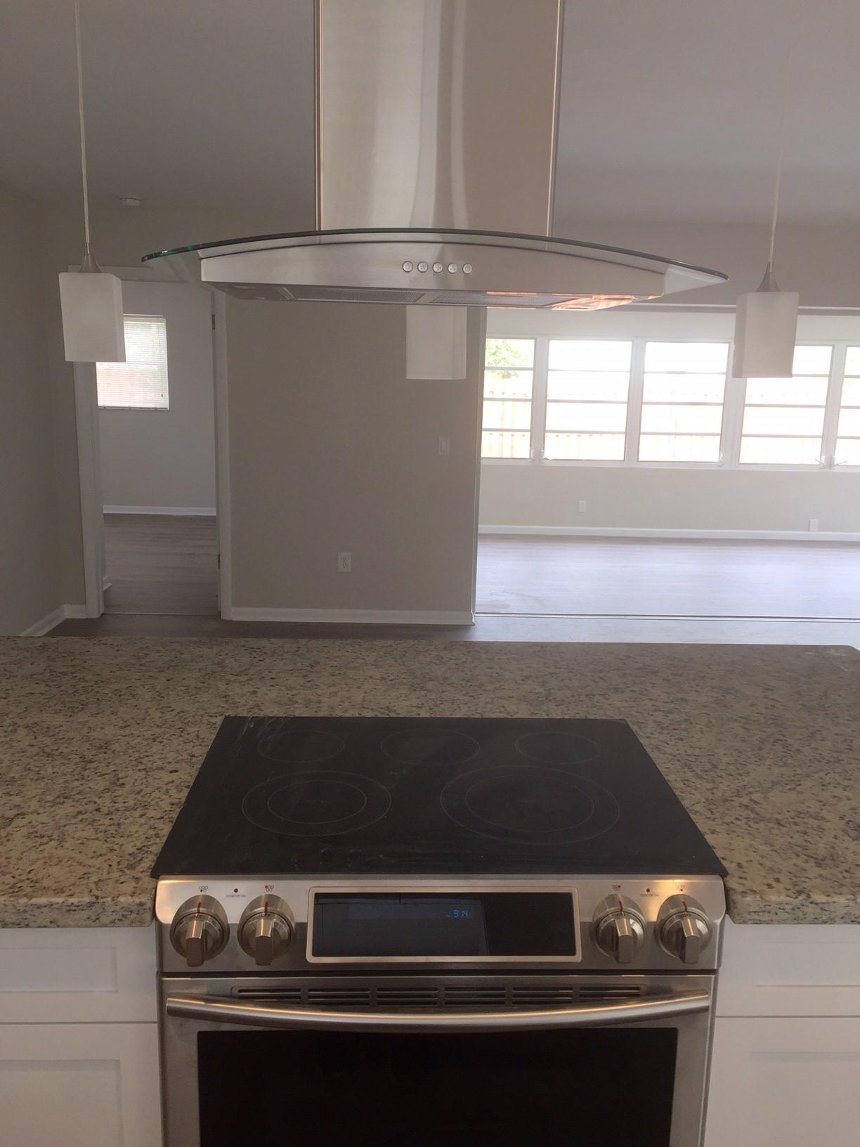 113 Park Lane East Lake Worth, FL 33462 - Photo 8 of 19 Open kitchen looking at range out to the