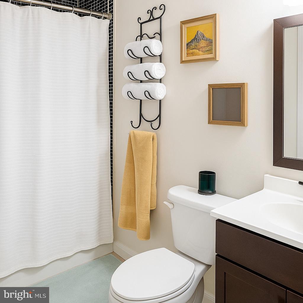 749 Gresham Place Northwest Washington, DC 20001 - Photo 11 of 20 a white toilet sitting next to a bathroom sink