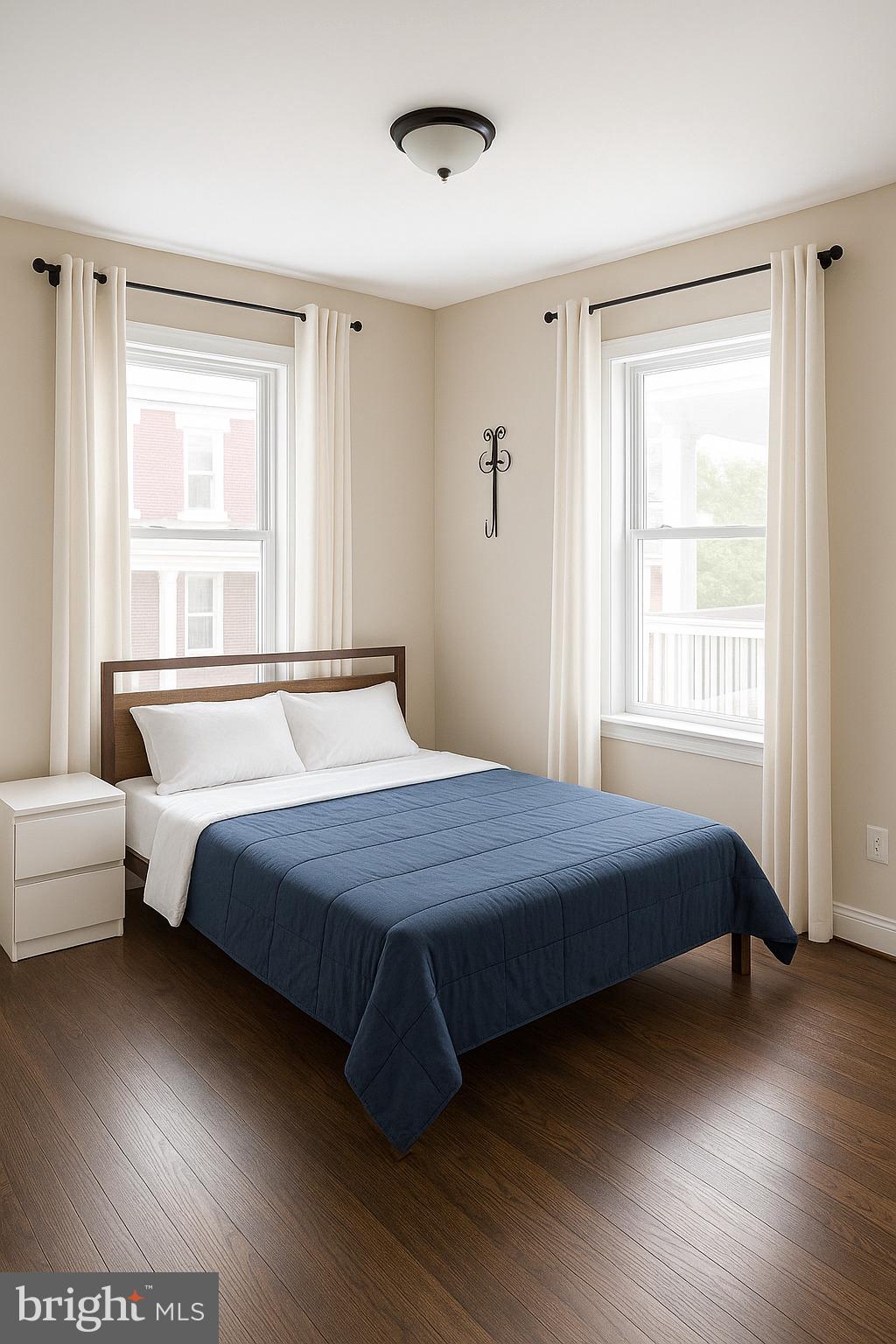 749 Gresham Place Northwest Washington, DC 20001 - Photo 14 of 20 a bedroom with a bed and wooden floor