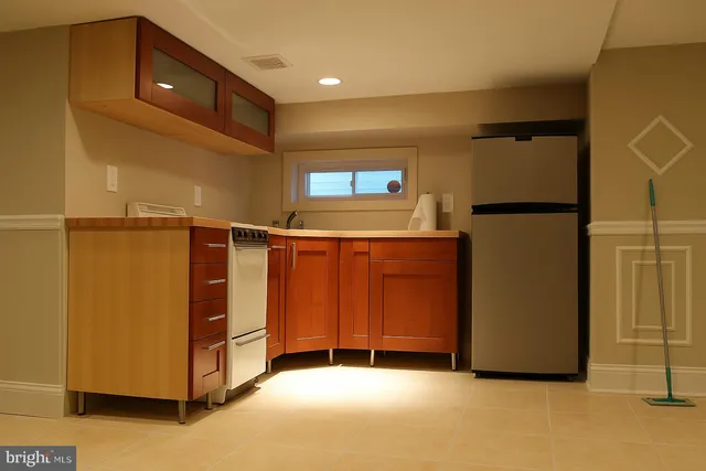 a view of an empty room with windows