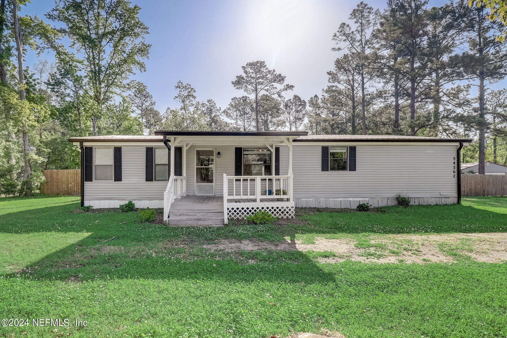 54262 Vikki Road Callahan, FL 32011 - Photo 1 of 48 a house that has a backyard