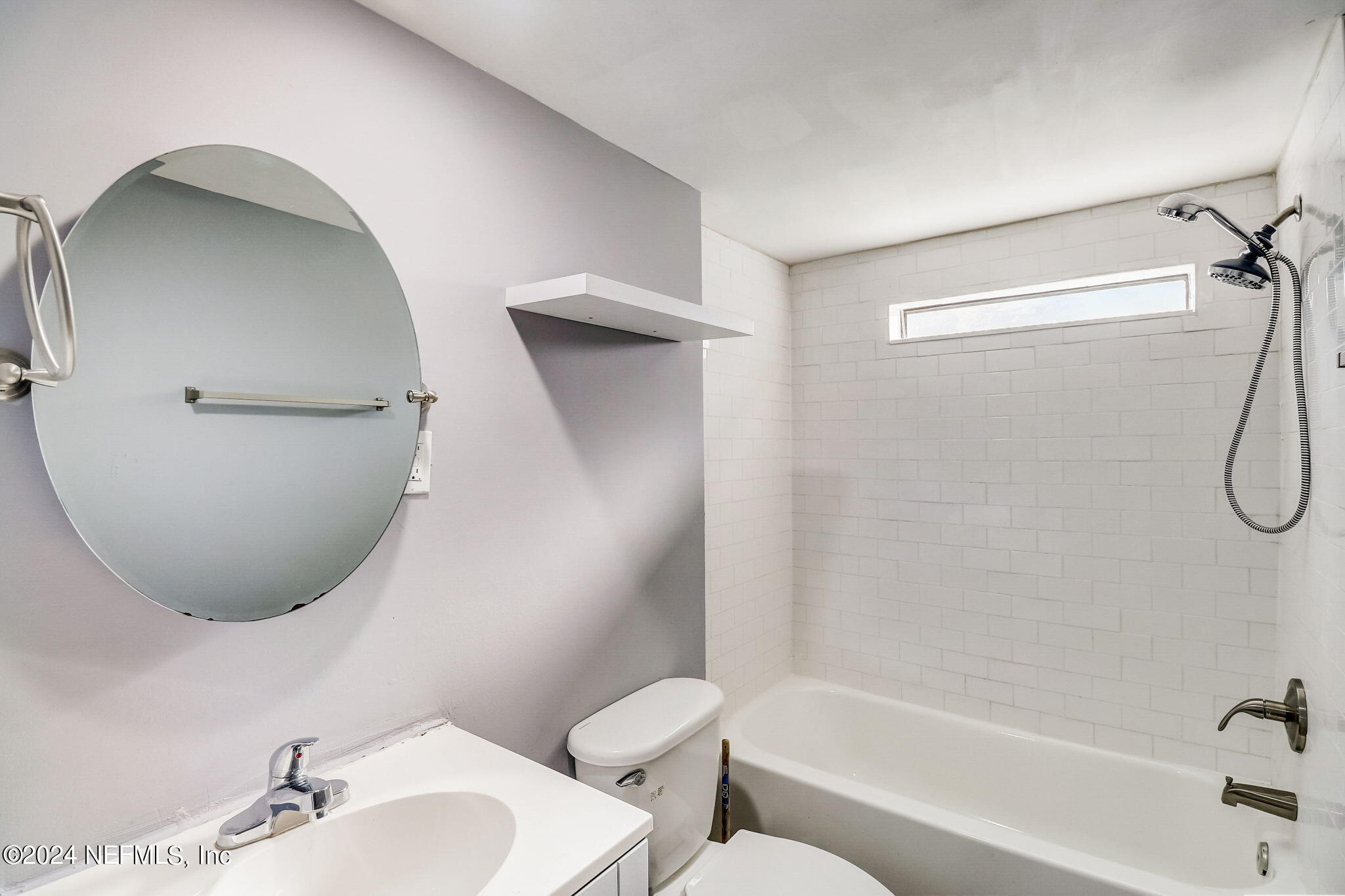 54262 Vikki Road Callahan, FL 32011 - Photo 22 of 48 a bathroom with a toilet sink and bathtub