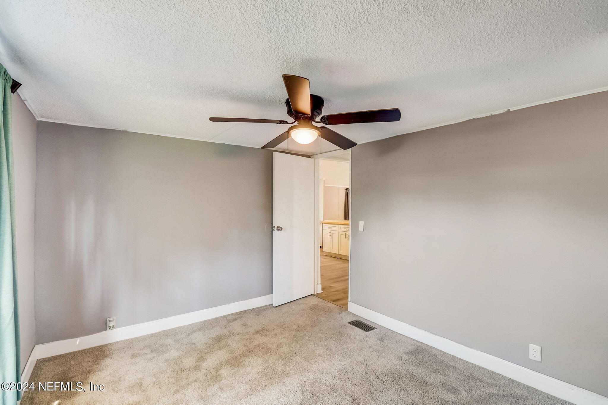 54262 Vikki Road Callahan, FL 32011 - Photo 27 of 48 a view of a room with a ceiling fan