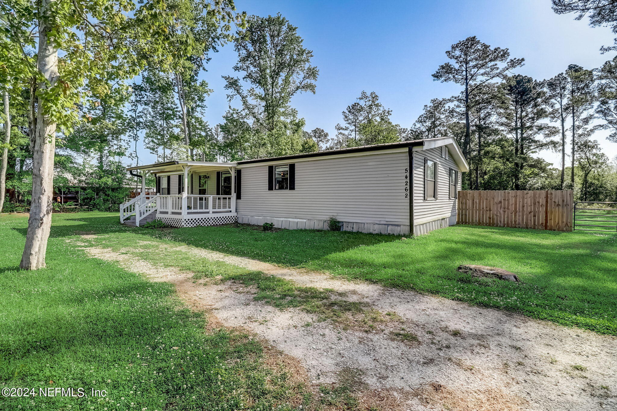 54262 Vikki Road Callahan, FL 32011 - Photo 3 of 48 a view of house with backyard and a garden